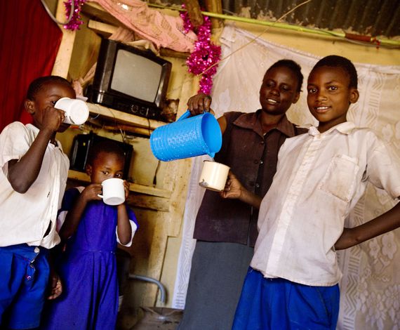 Carbon Finance Funding safe water: Children drink water from their Aqua Clara Filter